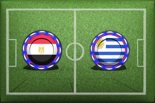 Football, World Cup 2018, game Group A, Egypt - Uruguay, Friday, June 15, Button with national flags on the green grass.