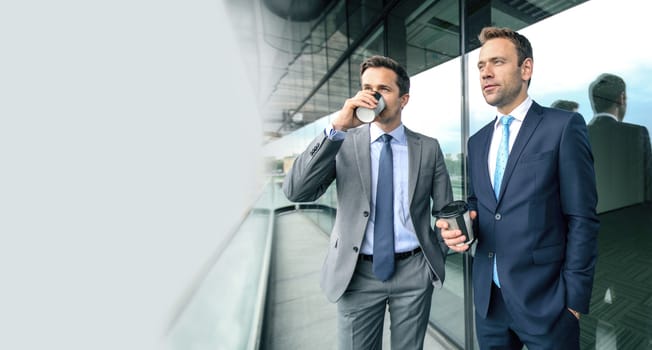 Business people having coffee break at the balcony of office building