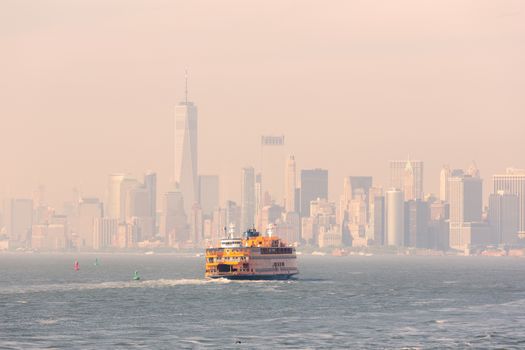 Staten Island Ferry and Lower Manhattan Skyline, New York City, USA.