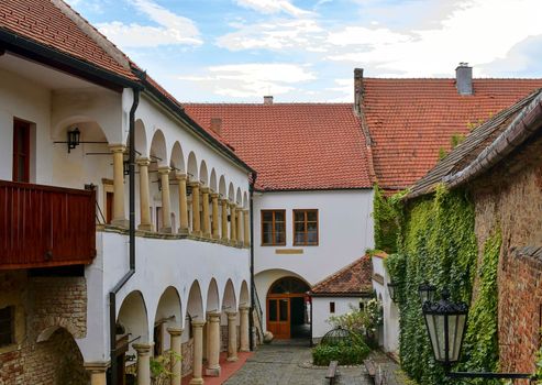 View on romantic urban scenery. Historic urban backyard. Renaissance house with arcades. 