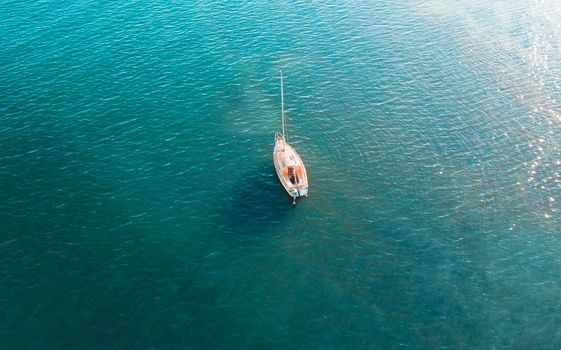 Overhead view of yacht on beautiful blue waters