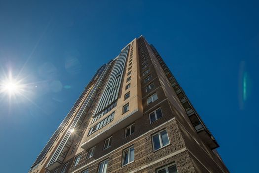 Modern building exterior low angle view with blue sky