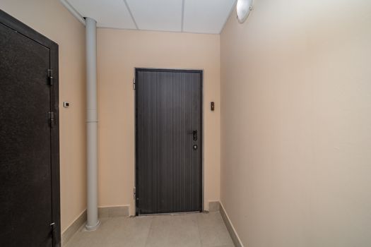 Residential building apartment doors entrance with door bell