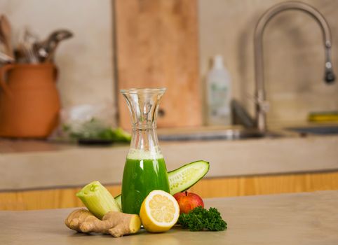 Glass jar of green juice, a detox beverage.  