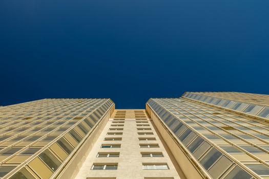 Modern building exterior low angle view with blue sky
