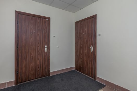 Residential building apartment doors entrance with door bell