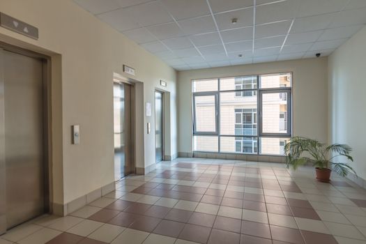 empty modern elevator or lift with closed metal doors