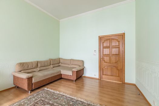 Cozy comfortable new sofa standing in empty modern room