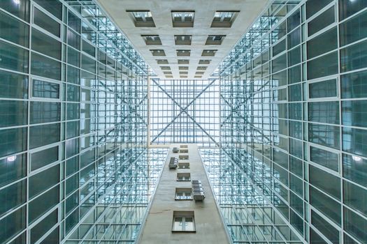 Blue glass ceiling and windows in modern office building