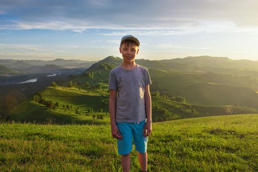 Young explorer at the sunset in Altai mountains