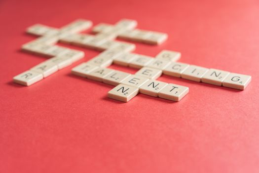 playing scrabble on a red table