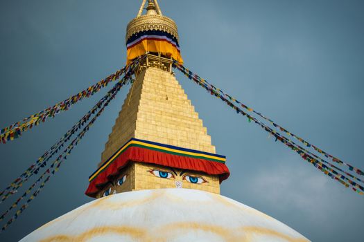 Boudhanath stupa in Kathmandu, Nepal. Stormy clouds in the background.