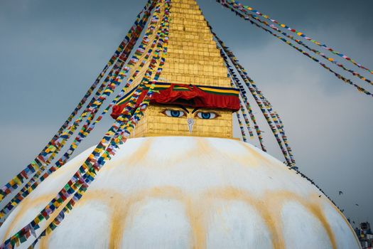 Boudhanath stupa in Kathmandu, Nepal. Stormy clouds in the background.