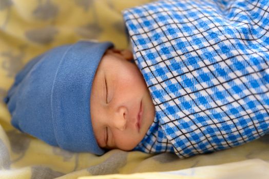 Cute Eurasian newborn baby sleeping