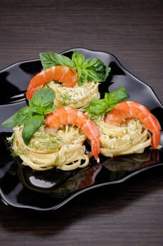 Nests of spaghetti with parmesan flavored with dill, shrimp and basil.