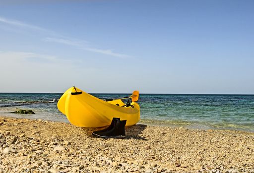 The lonely boat is dried on seacoast after long navigation