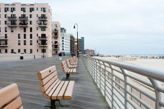  benchs in a new area on the seaside promenade  with wooden flooring