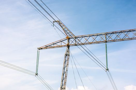 power lines tower against the blue sky. lovely energy industry background. efficient electricity delivery concept.