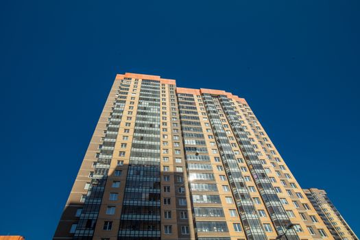 Modern building exterior low angle view with blue sky