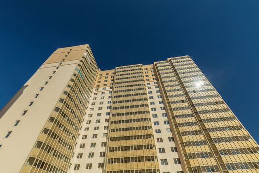 Modern building exterior low angle view with blue sky