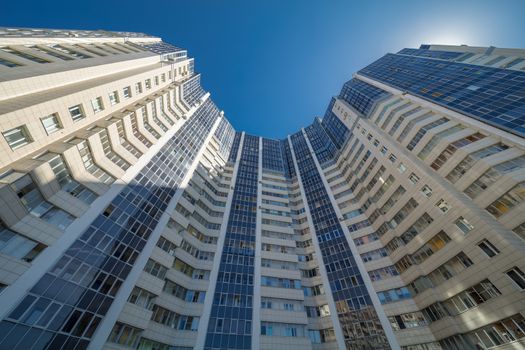 Modern building exterior low angle view with blue sky