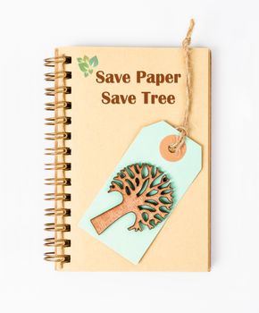 Save paper save tree on recycle diary. Ecology recycle concept.