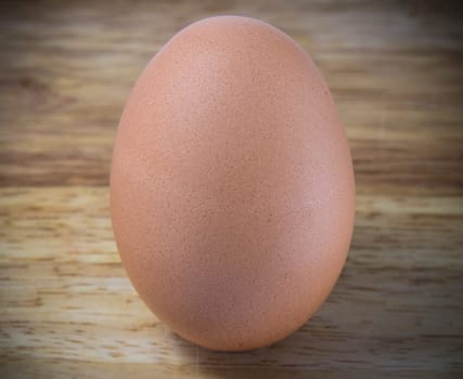 A Chicken Egg on the wood