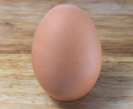 A Chicken Egg on the wood