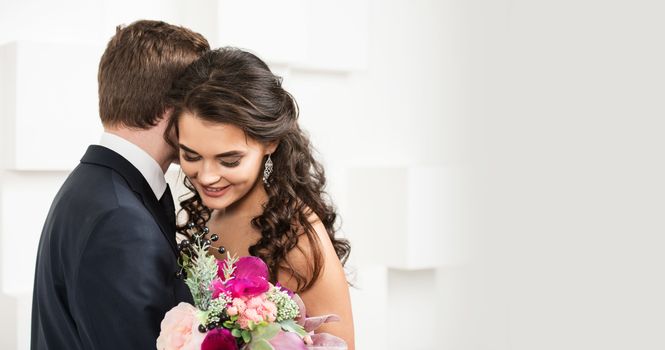 Bride and groom with bridal bouquet ready for wedding