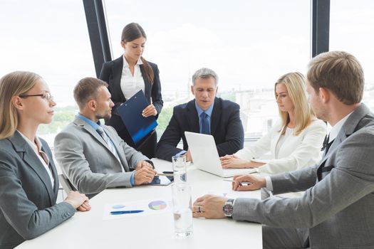 Business people team at meeting working documents together in office