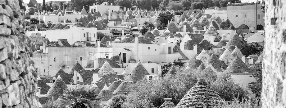 Scenic panoramic view of Alberobello town and its typical trulli buildings, Apulia, Italy