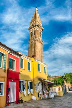 The leaning belltower of St Martin Church, iconic landmark on the island of Burano, Venice, Italy