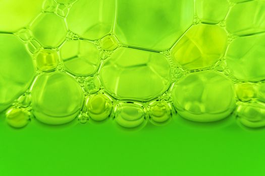 close-up shot of green soap bubbles. suds texture