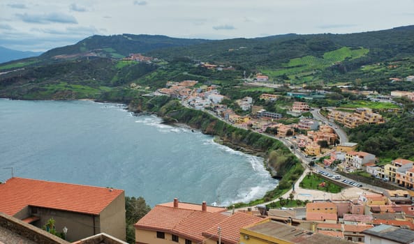 the raod to castelsardo seen from the highest point of the city with the ocean as background