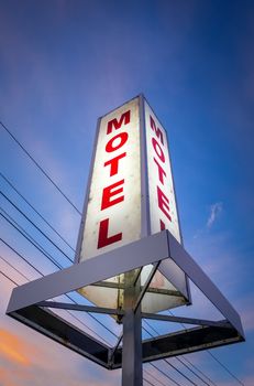 Vintage motel light sign at sunset, New Zealand
