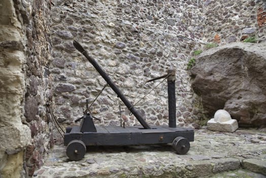 Wooden medieval catapult ballistic device, used to catapult stones to the ennemy