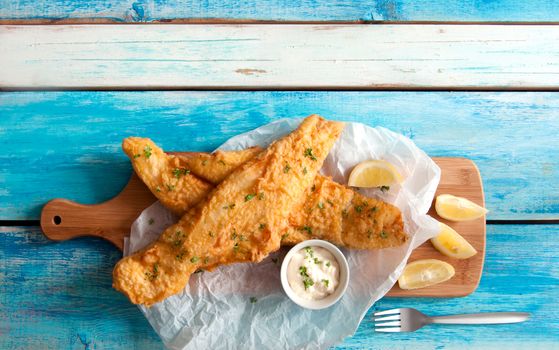 Two pieces of cod fried in batter