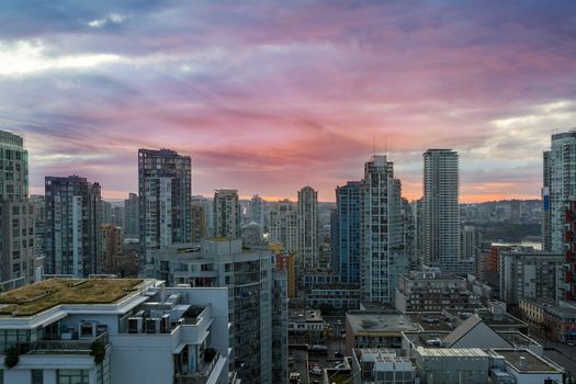 Sunrise over city downtown condominiums Vancouver BC British Columbia Canada