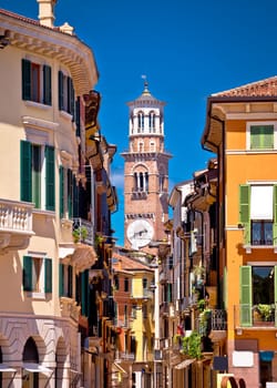 Verona colorful street and Lamberti tower view, tourist destination in Veneto region of Italy
