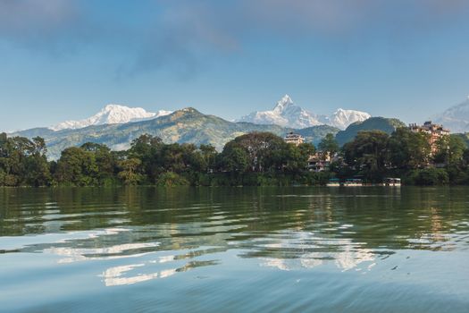 The Machapuchare and Annapurna range seen from Phewa Lake in Pokhara, Nepal