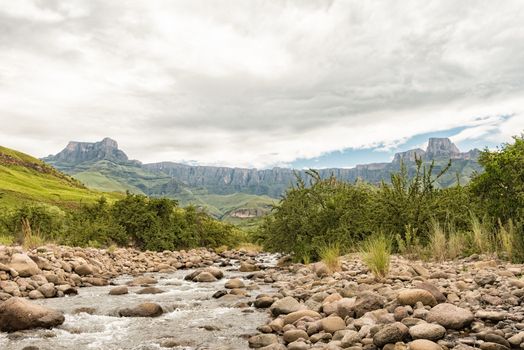The Tugela River, with the Amphitheatre in the Kwazulu-Natal Drakensberg, in the back