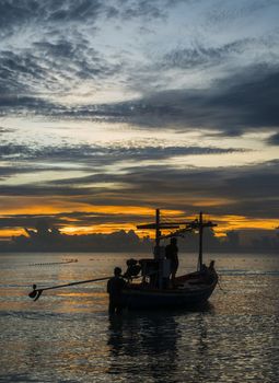 A fishing boat is ready to work in dawn.
