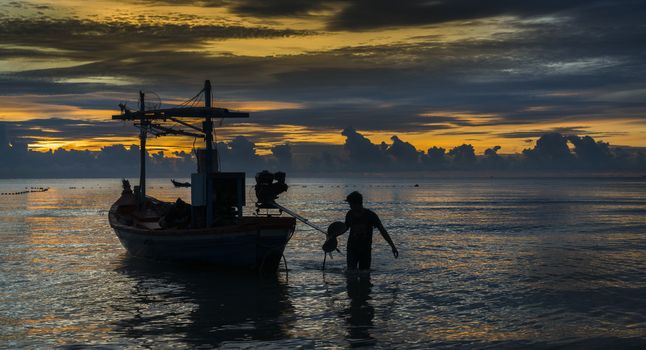 Fisherman ready for work in dawn.