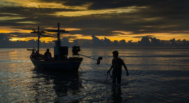 Fisherman finish work after sunset.