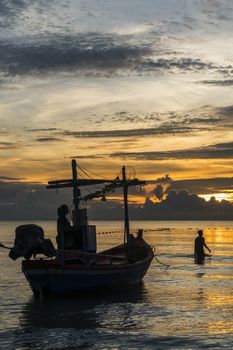 Fisherman prepare to work in dawn.