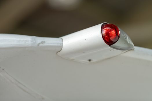 Wing of an airplane with position lighting, detailed close up photo