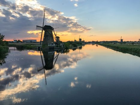 Beautiful dutch windmill landscape at the famous Kinderdijk canals, UNESCO world heritage site