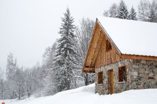Chalet covered with snow in the French Alps