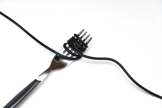 a black electric cable wrapped on a fork