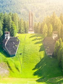 Old abandoned ski jump in Cortina d'Ampezzo - place of Winter Olympics in 1956 - in summer season. Dolomites, Italy.